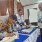 Penandatanganan naskah MoU antara Polres dan PGRI Asmat. (KabarPapua.co/Abdel Syah)